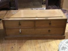 A 19thc beech low bench seat, the panel top above two short and one long drawer, on a plinth base (