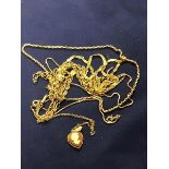 A mixed lot of 9ct gold and yellow metal chains together with a cameo pendant (18.1g)
