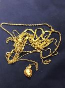 A mixed lot of 9ct gold and yellow metal chains together with a cameo pendant (18.1g)