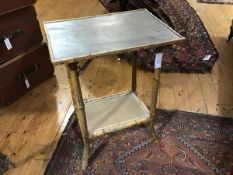 A 1920s bamboo side table, the rectangular top with moulded raised on bamboo supports, united by
