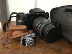 A Mycro miniature camera in leather case together with a Pentax SFX 35mm camera with a Pentax-F