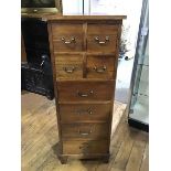 A 19thc style hardwood bank of drawers, the plain square top above four drawers, with brass drop