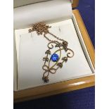 A 9ct gold Edwardian lady's pendant set blue stones and pearls, on 9ct chain (5.2g)