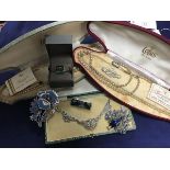 A mixed lot including two cased sets of pearl beads, a marcasite necklace, brooches, bar brooches (a