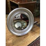 A 19thc style circular wall mirror with moulded frame (67cm x 55cm)