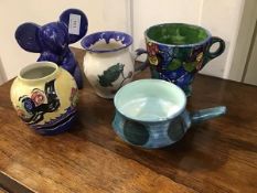 A mixed lot of handpainted Studio Pottery including a large handpainted breakfast cup with floral