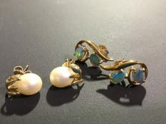 A pair of oval cultured pearl stud earrings, mounted on leaf posts; together with a pair of 9ct gold