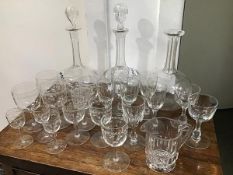 A mixed lot of glassware including three cut and etched decanters together with a mixed lot of