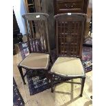 A pair of Edwardian mahogany bedroom chairs, the pierced splats inlaid with urn decoration,