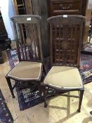 A pair of Edwardian mahogany bedroom chairs, the pierced splats inlaid with urn decoration,