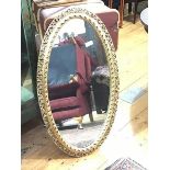 An Edwardian style oval gilt framed wall mirror (104cm x 57cm)