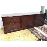 A modern mahogany filing cabinet, in the style of a Georgian chest of drawers, the rectangular top