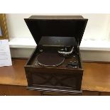 An early 20thc His Master's Voice gramophone, the moulded hinged case with transfer label, enclosing