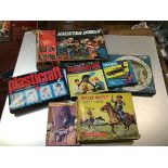 A group of vintage children's games including Haunted House, Wild West Race Game, Frustration,