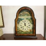 A reproduction arched yew wood mantel clock with printed dial with striking chiming movement, with