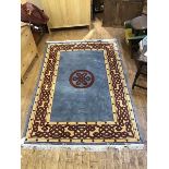 A modern hand knotted carpet, the blue/grey field with knotwork medallion within a camel guard