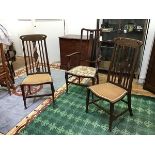 A pair of Art Nouveau style side chairs, c.1900, the top rails inlaid with an urn, and tied swags,