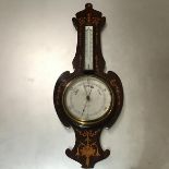 An Edwardian rosewood satinwood inlaid banjo shaped barometer, complete with thermometer (a/f),