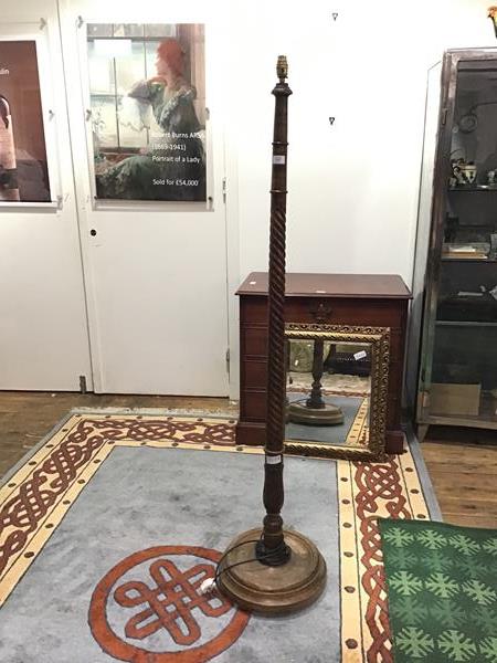 A 1940s floor lamp, the spiral turned column above a baluster soccle and dished circular base (h.