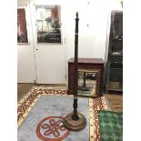 A 1940s floor lamp, the spiral turned column above a baluster soccle and dished circular base (h.