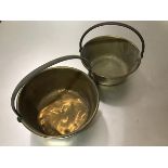 A pair of brass preserve pans with cast iron loop handles to top (d.26cm)
