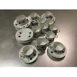 A Mid Century thirty four piece tea/coffee set with transfer printed snowflake design