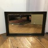 An Edwardian rectangular mirror with bevelled glass plate and silvered brown painted frame (37cm x