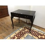 A small mahogany side table, in the George III style, the rectangular top with moulded edge above