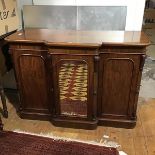 A Victorian mahogany side cabinet, by R. Dodgson & Co., Ulverston, the break front top above a