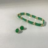 A Chinese 14ct gold mounted modern jadeite panelled bracelet and matching pair of circular stud