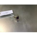 A dress ring mounted mixed cut amethyst on 9ct gold shank (T) (4.12g)