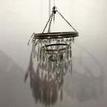A three tier pendant light fitting with faceted drops and a box containing extra drops (h.36cm x d.
