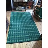 A modern flatwoven carpet, the green field decorated with bands of serrated motifs in a grid