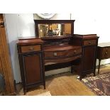 An Edwardian mahogany mirror back sideboard, the dentil cornice and bevelled mirror plate above a