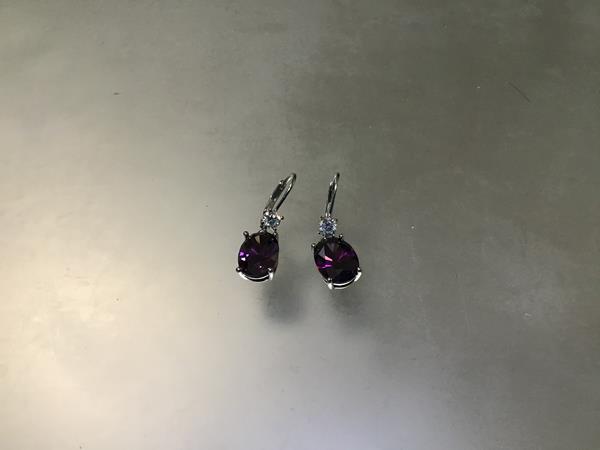 A pair of amethyst set drop earrings with paste set clip fastenings