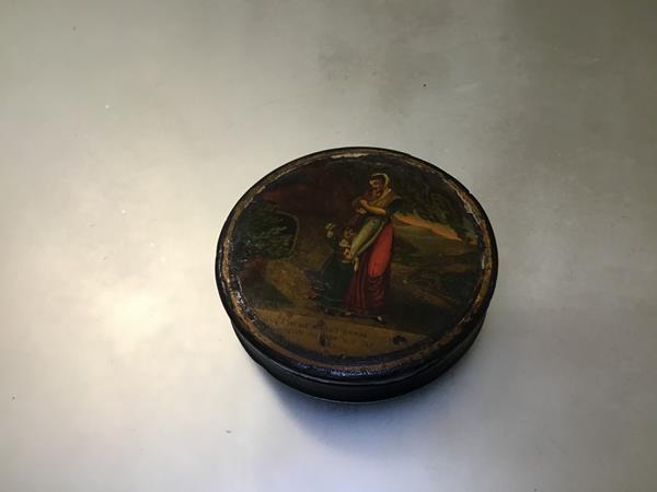 A 19thc papier mache snuff box, with a decoupage panel, mother and children, with motto (h.2mc x