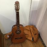 A Spanish six string guitar with satinwood front, complete with vinyl case, interior label, with