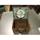 A 1920s/30s Brexton picnic basket containing two side plates, two saucers, one fork, knife and