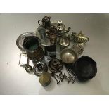 A collection of Epns ware to include a salver, knife rests, nutcrack, a chamber candlestick, a
