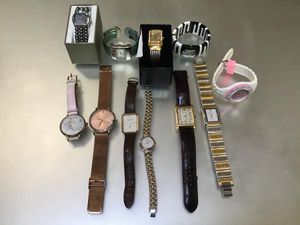 A collection of eleven watches including a Mappin & Webb gilt metal watch on lizard strap, a Sekonda