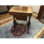 A figured walnut work table, c.1870, the hinged rectangular top enclosing a fitted interior above