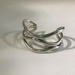 A Giorgio Armani silver figure of eight bangle (53.93g) (6cm x 2.5cm)