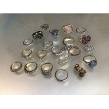 A collection of white metal and yellow metal and silver QVC style dress rings including three