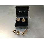 A pair of 9ct gold stud earrings of tubular spiral design and two pairs of 9ct gold knot earrings (a