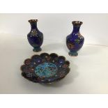 A pair of Chinese cloisonne vases, with a lotus and scrolling vine pattern (h.13cm) and a