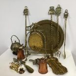 A collection of brassware including an Edwardian dinner gong with engraved decoration (h.34cm x 20cm