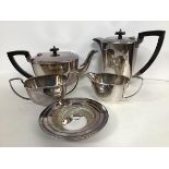 A silver plated Georgian style four piece tea service including a teapot, coffee pot (h.17cm), sugar