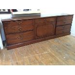 A mahogany filing cabinet in the style of a Georgian side cabinet, the rectangular top with
