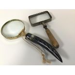 A modern brass horn handled table magnifying glass (l.22cm) and an Edwardian metal rectangular table