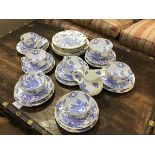 A Royal Worcester Dragon pattern blue white and gilt decorated thirty one piece breakfast set